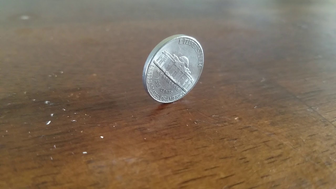 [] Investigating the probability of a cylindrical coin landing on its side