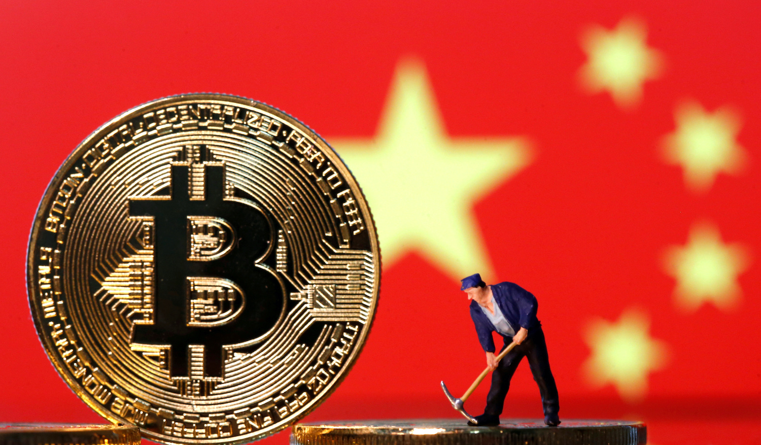 Bruised by stock market, Chinese rush into banned bitcoin | Reuters